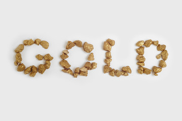 Gold nuggets text background. Finance and rates