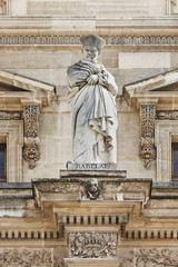 Fototapeta na wymiar Sculpture of an ancient figure, Louvre Museum, Paris