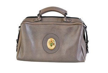 Brown vintage valise isolated on a white background. Ladies Old