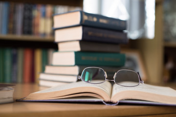 Stack of Books and Reading Glasses