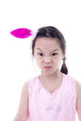 Funny angry face Asian girl on white.