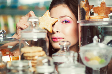 Christmas biscuit concept. Portrait of young brunette