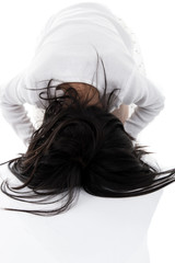 Asian girl praying with clasped hands with blank copy space