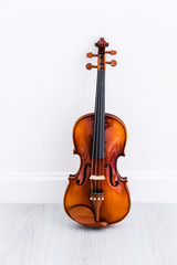 Fototapeta na wymiar Classical cello on white wall background