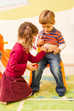 Children playing doctor and patient