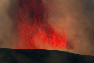 Volcano eruption. Mount Etna erupting from the crater Voragine
