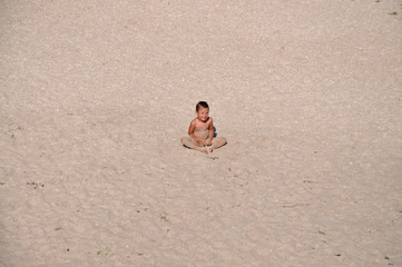 lonely boy in the sand