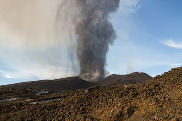 Volcano eruption. Mount Etna erupting from the crater Voragine
