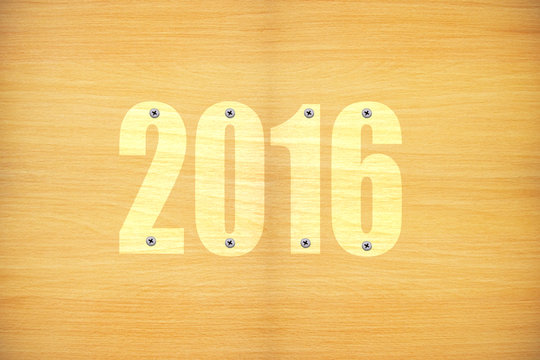 Happy new year 2016 on the patterns wooden background