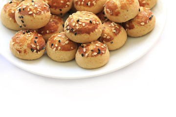 Sesame cookies on the plate .