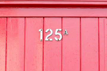 House number 125A sign