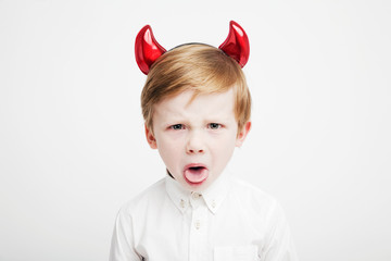  Angry naughty child with red horns