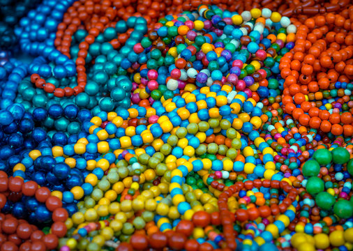Bright background of colorful wooden beads in folk style.