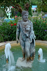 Man and Lion head statue with fountain