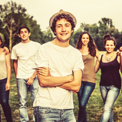 Young Man with Group of Friends at the Park