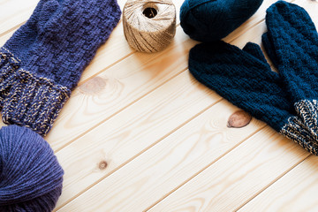 Fototapeta na wymiar Knitted mittens and yarns