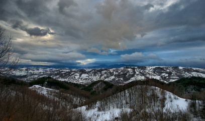 Fototapeta na wymiar Wintertime landscape featuring snowy mountain