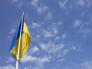 Blue and yellow flag on the background of sky, Ukraine