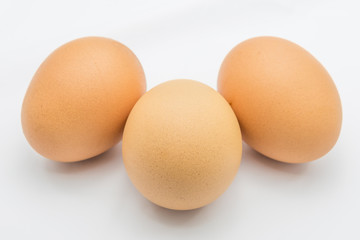 Three eggs isolated on white background