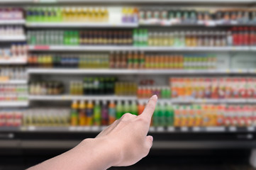 Blurred background,Supermarket shop blur background with finger point