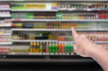 Blurred background,Supermarket shop blur background with finger point