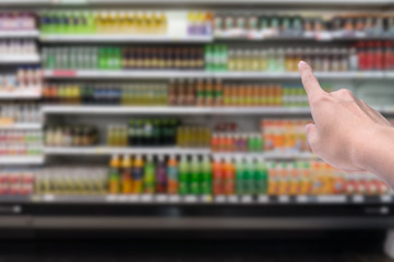 Blurred background,Supermarket shop blur background with finger point