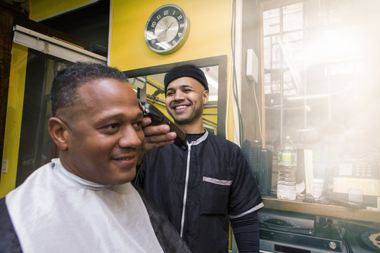 Barber Giving his Client a Haircut, In Barber Shop
