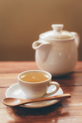 cup of tea on the wood desk