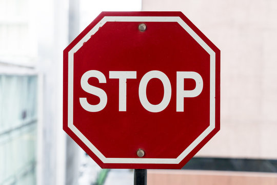stop sign on big city