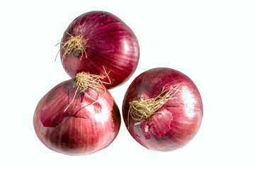 Three heads of red onion