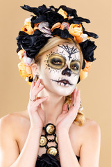 attractive young woman with sugar skull makeup,Dia de los Muertos - Mexican Day of the dead woman...