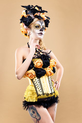 attractive young woman with sugar skull makeup,Dia de los Muertos - Mexican Day of the dead woman wearing sugar skull makeup and flower wreath.