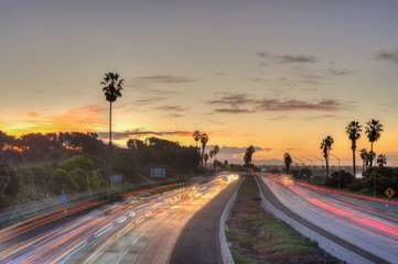 Freeway traffic hurries as a new day begins. 