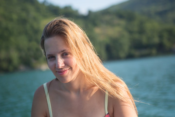 Woman traveling by boat at sunset among the islands.