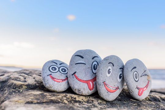Emoticons on pebbles