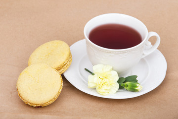 Obraz na płótnie Canvas tea and macaroon on white