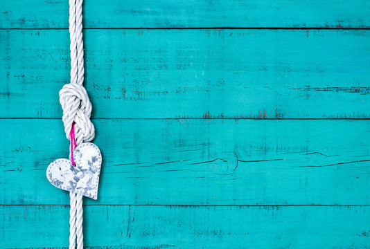 Blank rustic sign with white rope border and silver tin heart