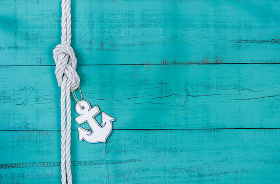 Blank rustic teal blue sign with rope and anchor border