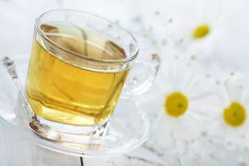 Cup of tea with chamomile flower