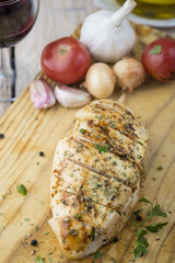 Marinated grilled healthy chicken breasts cooked on a summer BBQ