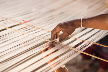 white silk thread in sewing or weaving machine,texture,backgroun