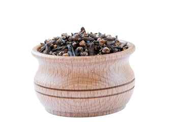 cloves in a wooden bowl isolate on a white background