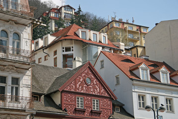 Fototapeta na wymiar KARLOVY VARY, CZECH REPUBLIC - APRIL 20, 2010: Buildings in Karlovy Vary or Carlsbad that is a spa town situated in western Bohemia, Czech Republic