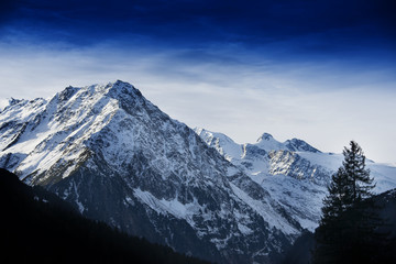 Obraz premium High mountains covered with snow - Alps in winter