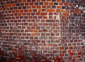 Round wall from old red bricks.