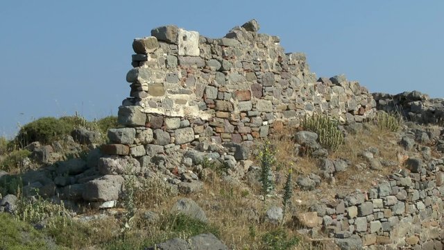 Ruins of an ancient wall on the sky background. The island of Lemnos, Greece.
