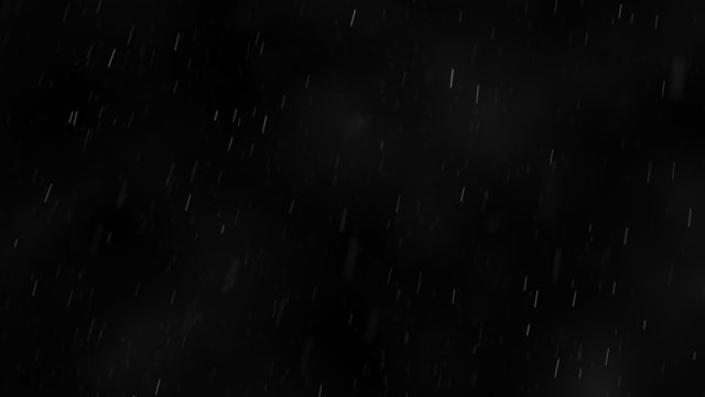 Wide angle shot of rain falling against the black background. Loopable. HD