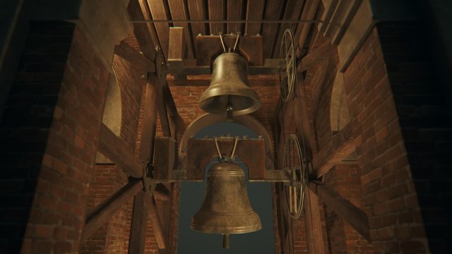 Bronze bell hanging in a brick bell tower with wooden beams