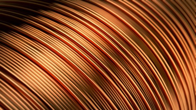 Close up of pure copper wire on the spool. Used in the electrical industry.