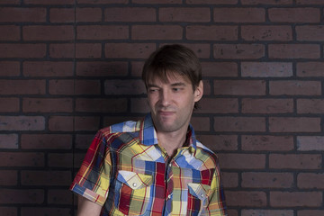 Portrait of young disgusted man